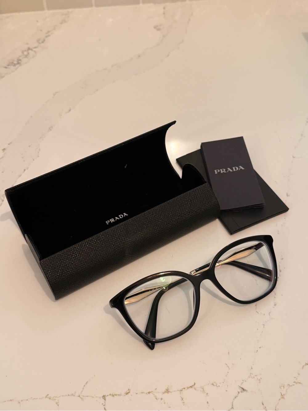 Prada Black Cat-Eye Optical Glasses with Gold Accents